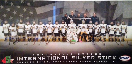 A posed photo of a youth hockey team and their coaches. Text reads: Huntsville Otters International Silver Stick 2016.