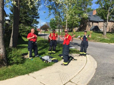 Four firefighters pose for the camera.