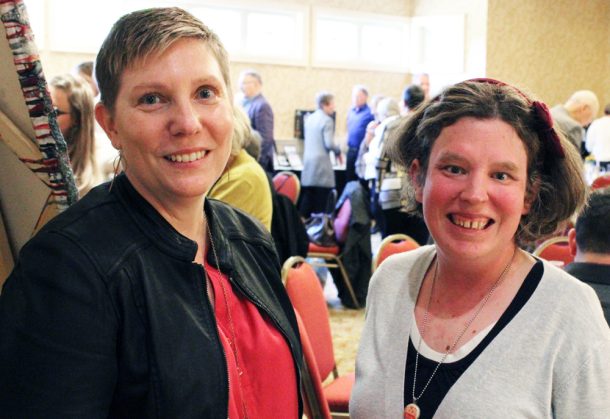 2 women smiling for the camera.