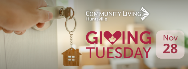 A hand turns a door handle with a key and house-shaped key chain in the lock, and the door opens onto a bright living room filled with moving boxes. Text reads: giving tuesday, November 28. 