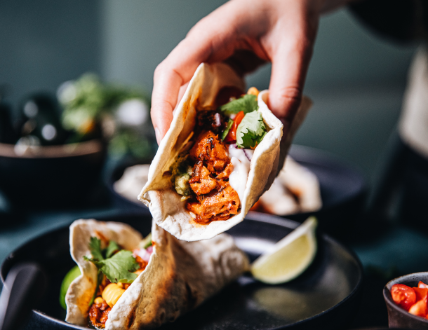 hand holding a vegan taco
